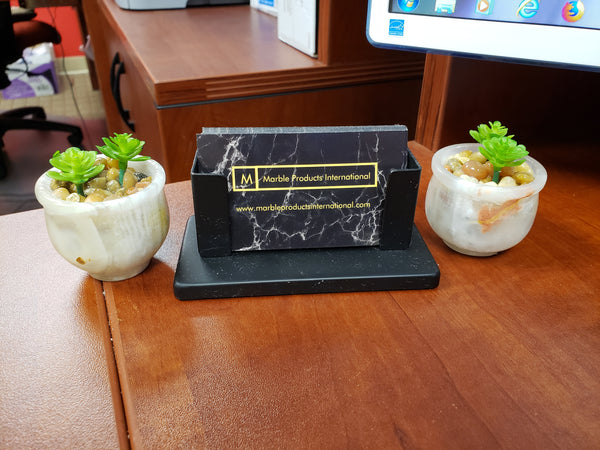 Faux floret succulents in a round onyx pot